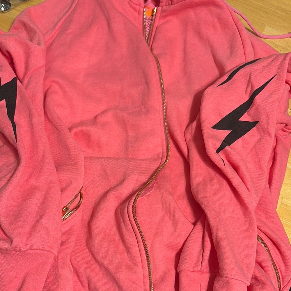 AVIATOR NATION Pink Hoodie with Black Lightning Bolt Design